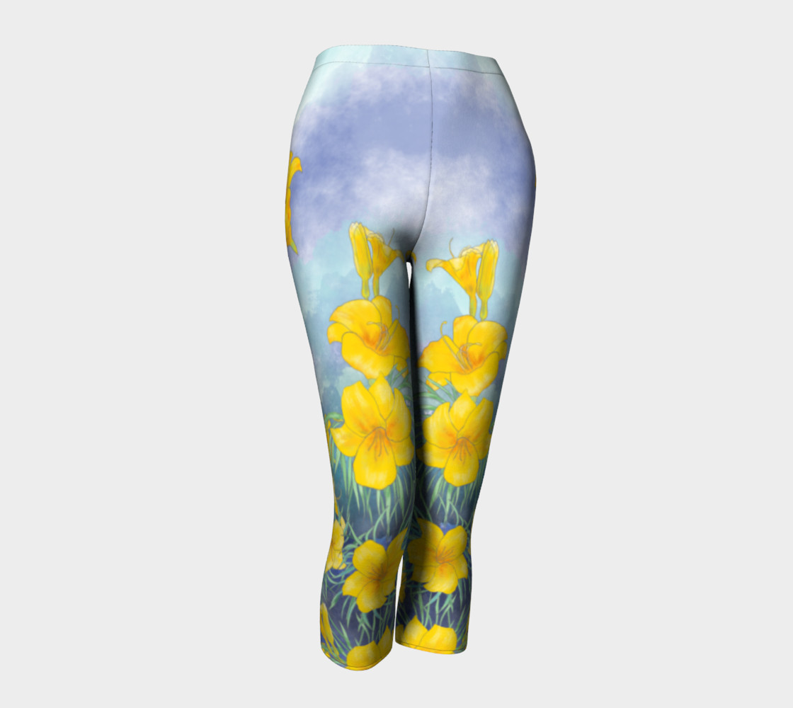 Yellow day lily flowers over cloudy sky capris preview #1