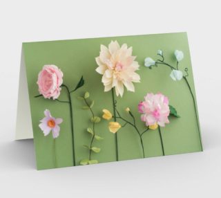 Crepe paper flowers on green preview