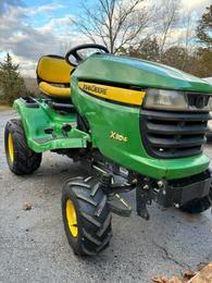 John Deere X304 four wheel steer with 42 inch two-stage snowblower  1 800