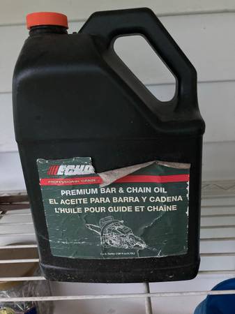 Photo New still sealed ECHO chainsaw and bar oil. Gallon can. $15