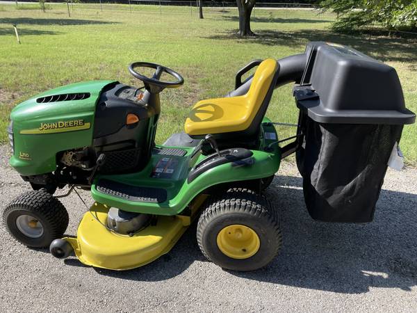 Photo John Deere L110 42 in. Riding Mower with Twin Bagger and Dump Cart $1,500