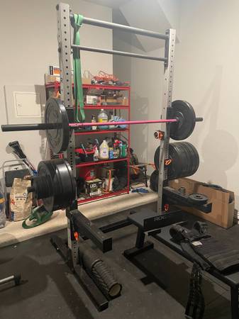 Photo Rogue squat rack and bumper plates $1,600