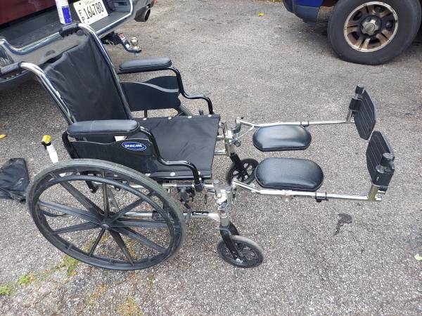 Photo Wheelchair with Leg Elevation Foot Rests $60