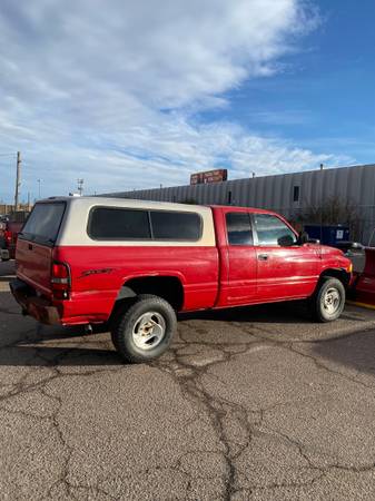 Photo 1998 Dodge Ram Sport 1500 with a Western Mid Weight snow plow - $8,500 (Denver)