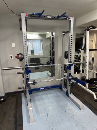 Photo Squat Rack with bars and plates $475