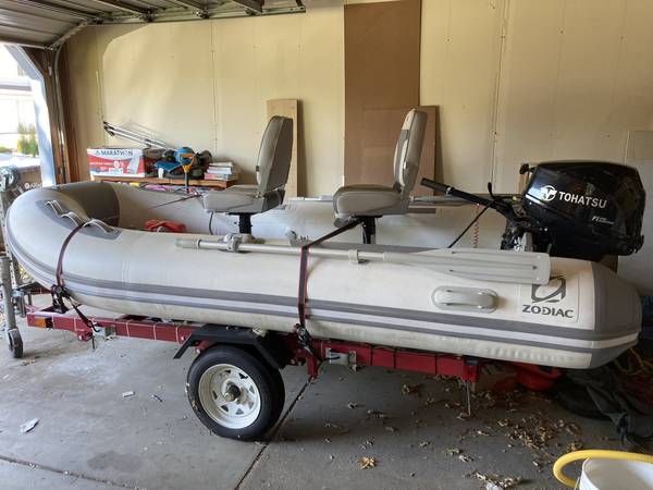 Zodiac inflatable with motor and trailer $2,800