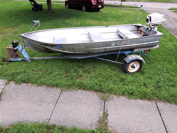 Photo fishing boat, trailer, antique motor $550