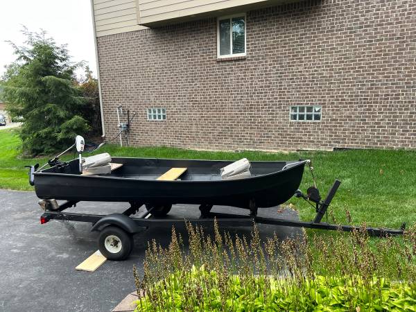 Photo 11.5 Jon Boat, trailer, and trolling motor $650