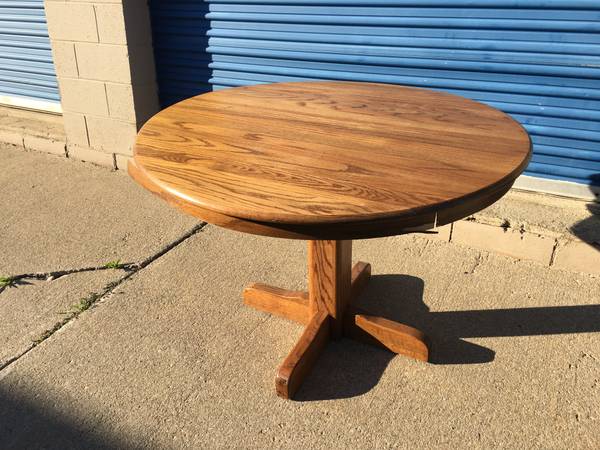 Photo Oak Dining Table, Round, Sides Fold Down $100