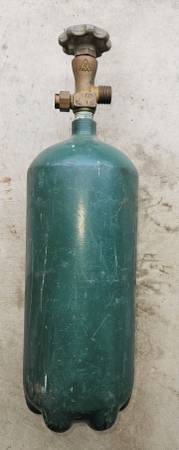Photo empty and out of date 10 cuft oxygen tank $25