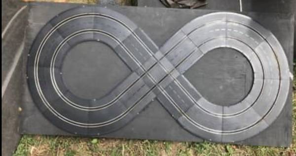 Photo 1960s slot car track attached to wood board $10