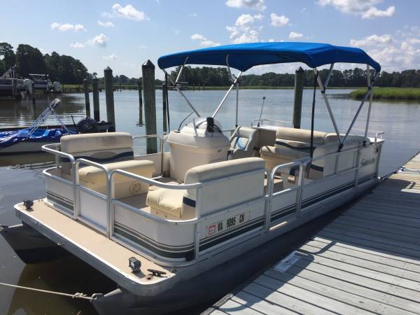 18 Pontoon boat and trailer $7,500