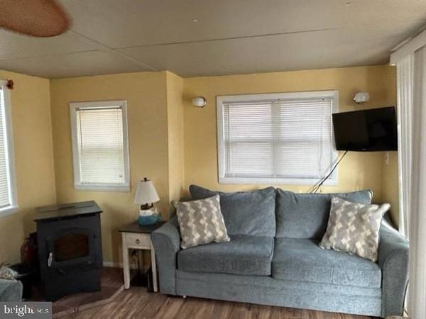 Photo Owners did all new windows, new rear door, new pellet stove $1,000