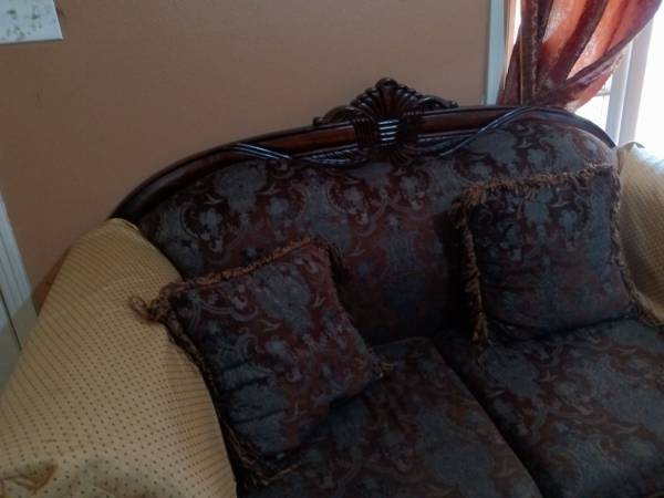 Photo three seater and two seater sofas slightly used $600