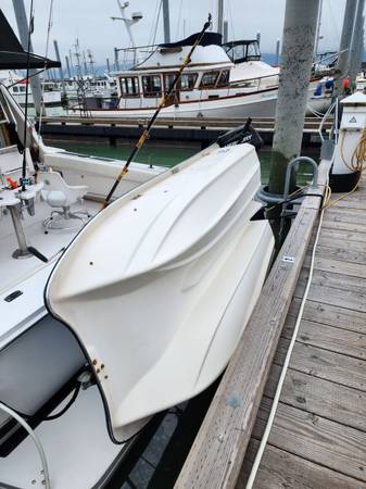 Photo Skiff and low hour 5 hp outboard $1,200