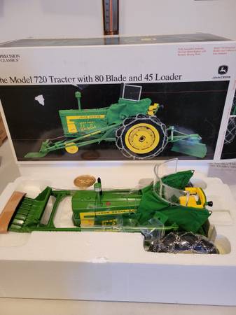 Photo 116 john deere precision 720 tractor with blade and loader $120