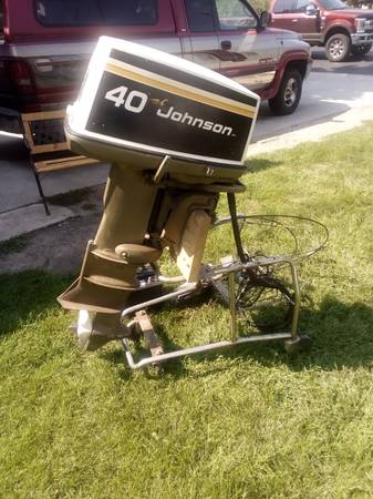Photo 1975 40hp Johnson outboard and misc $700