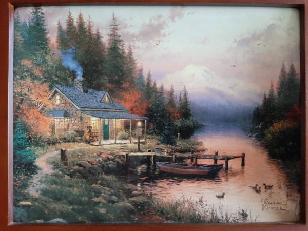 Photo Thomas Kinkade plate collection in a boat $170