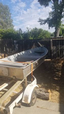 10 boat with trailer and 8 hp motor $1,400