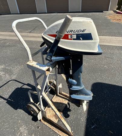 Photo Evinrude Outboard Motor 4 hp and stand $225