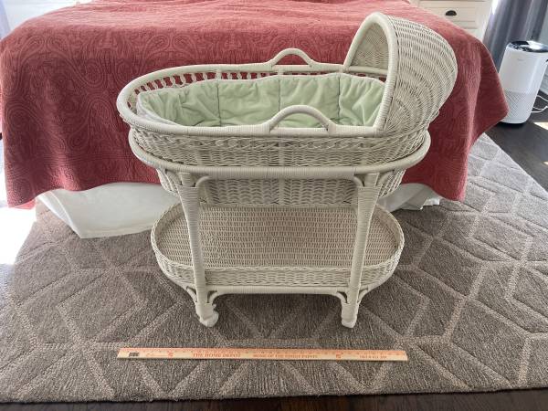 Photo Pottery Barn white wicker baby bassinet on wheels with linens. $80