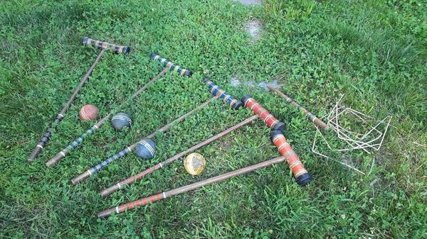 Photo Used Croquet Set with 4 balls and 5 mallets, 1 stake and 9 wickets $20