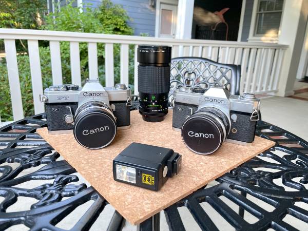Two Canon FT QL Silver SLR Film Cameras w50mm lens  Tokina 35-200m $85