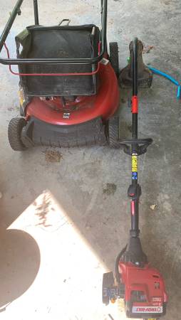 Photo Gas power weed eater and lawnmower $100