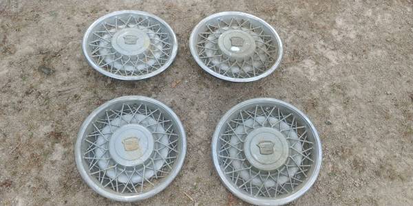 Photo Four Cadillac Old School 15 inch Wire Hubcaps $100 for the set $100
