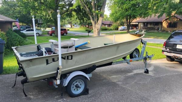 Photo 14 Lund fishing boat with Yamha 8HP and trailer $2,500