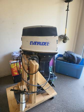 Photo 70hp evinrude 2 stroke outboard boat motor with controls $1,000