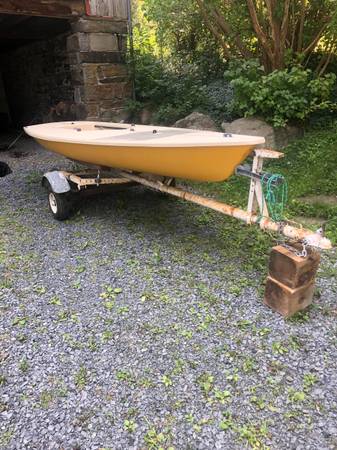 Laser sailboat and trailer $1,200