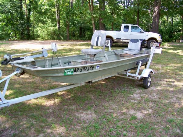 Photo 14 flat bottom boat,motor,and trailer $1,500
