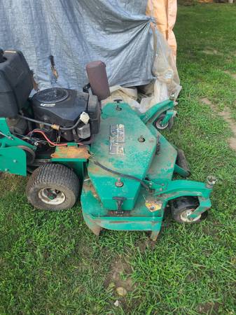 Photo 52 walk behind lesco commercial mower with Sulky $1,000