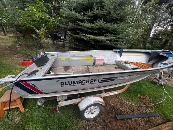 Photo 14 Aluminum fishing boat and 6hp motor. $1,250