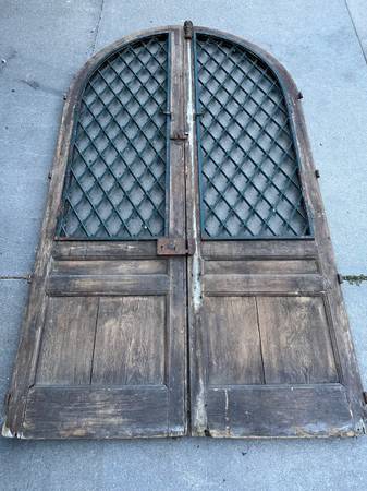 Photo antique arched wooden and wrought iron doors $1,800