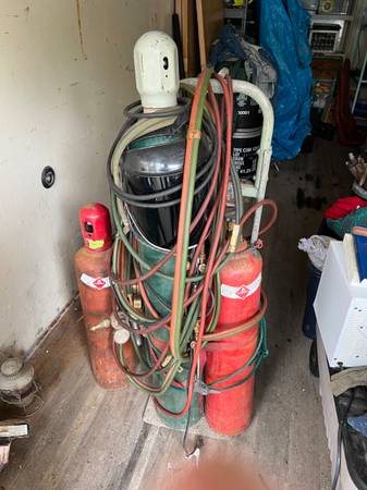 Photo Oxygen acetylene cutting torch and extra acetylene tank $450