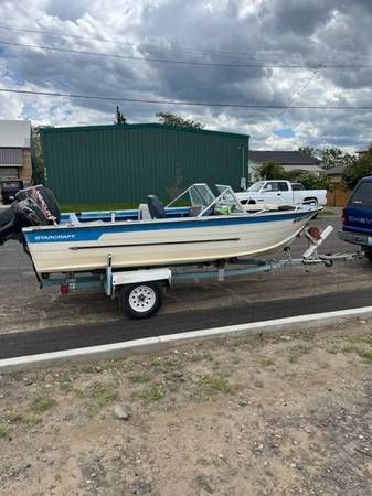 Photo 16 aluminum Startcraft boat and e-z load trailer $4,400