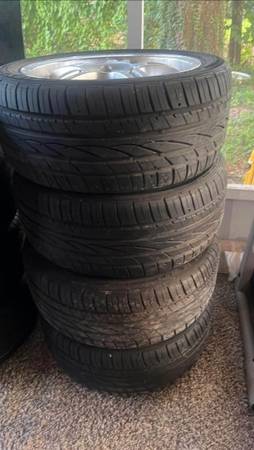 Photo 4 lug rim with tires came (matches with 89-93 fox body mustang) $300