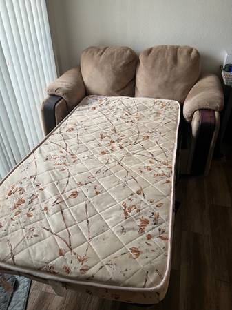 Photo two seater pull out mattress sofa $120