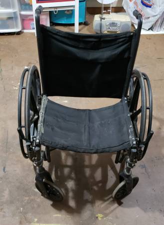 Photo used wide wheelchair, no foot rests $35