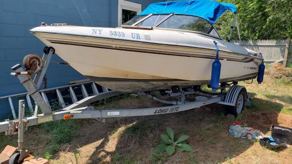 Sunbird boat with 115 hp outboard and trailer $2,500