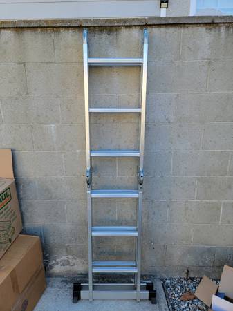Photo Like New 12 ft Multi Position Ladder $85