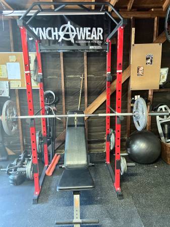 Photo Squat Rack Cage w Olympic weight set, benches, dumbbells. $1,000