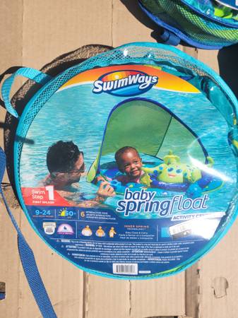 Photo SwimWays Baby Spring Float Activity Center, Inflatable Float for Baby $20