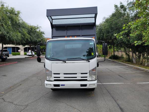 Photo dump truck 2014 isuzu npr 12ft dump truck $32,900