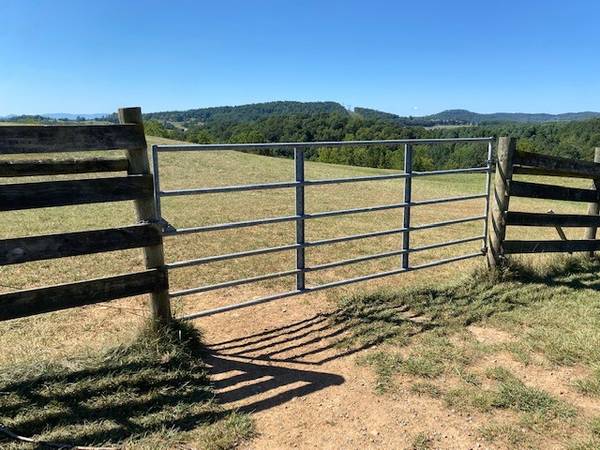 Photo heavy duty gates, mini trailer and 25gallon sprayer with tie downs $123