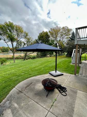 11 ft Cantilever Umbrella with heavy duty base $350