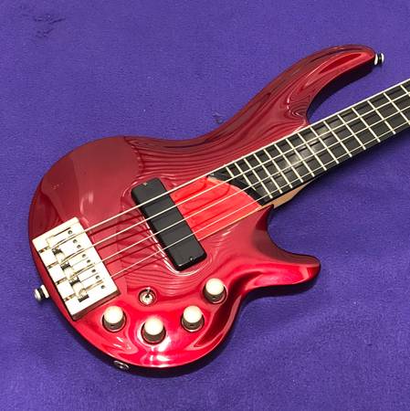 (29) Curbow 4 bass guitar in red finish with case $380