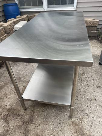 New 30x60 stainless steel work table located In south St. Paul $280